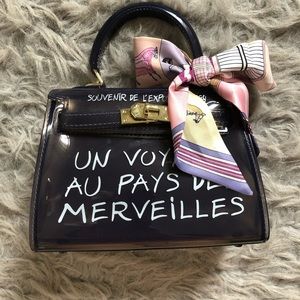 Un Voyage Purse